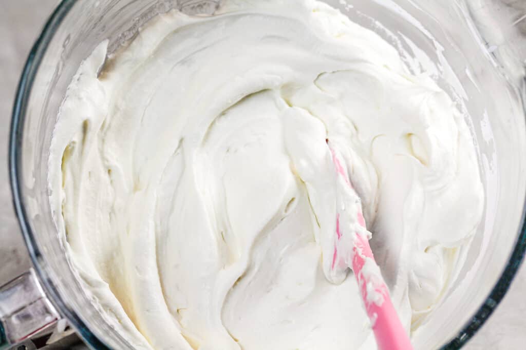 image of a bowl of fluffy bourbon cream cheese frosting