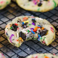image of funfetti oreo cookie that's been bitten into to show how soft and chewy it is