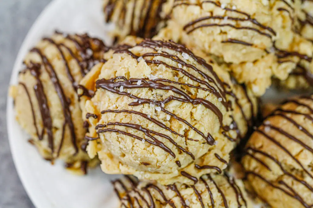 image of gluten free no bake cookies made with peanut butter and rice krispies stacked on a plate