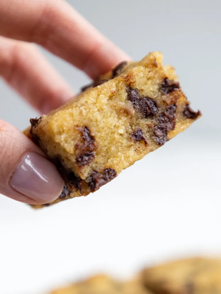 image of a banana chocolate chip bar that's been cut to show its tender and moist texture
