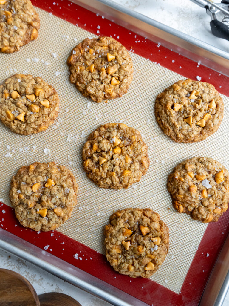 image of oatmeal scotchies that are cooling on a baking sheet