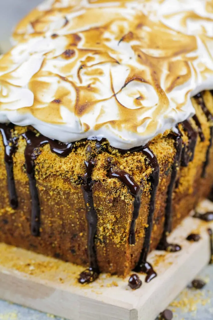 image of image of smores banana bread decorated with a chocolate drizzle and toasted marshmallow topping
