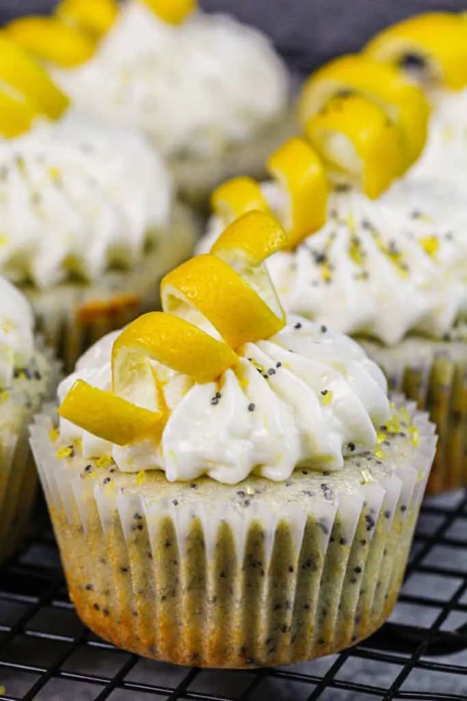image of lemon poppy seed cupcakes decorated with lemon peel swirls