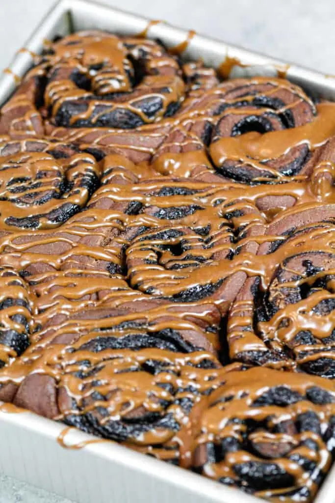 image of chocolate cinnamon rolls glazed in chocolate glaze