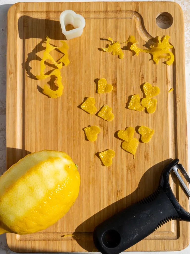 image of little lemon peel hearts that have been made using a vegetable peels and a small heart cutter