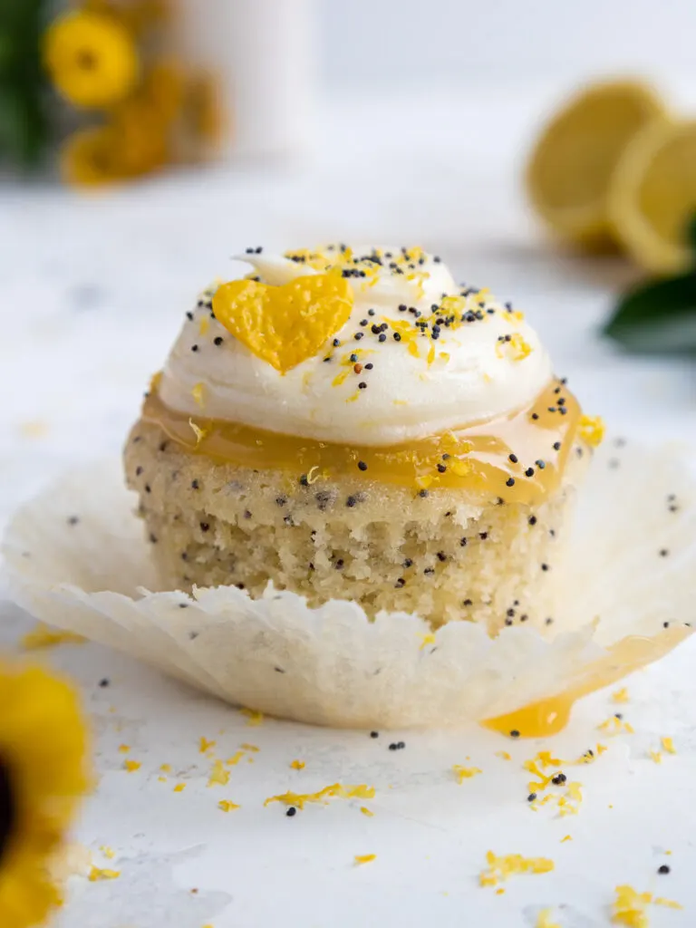 image of a cute lemon poppy seed cupcake that's been unwrapped from its cupcake liner