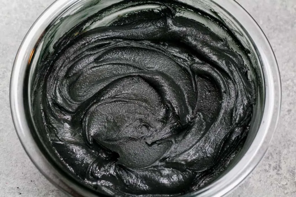 image of black cocoa buttercream frosting