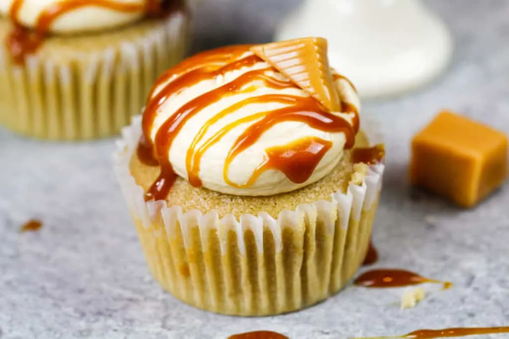image of a caramel cupcake decorate with a caramel drizzle