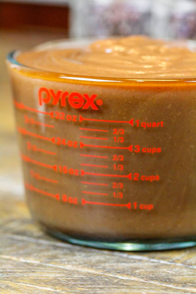 image of one batch of apple butter in a pyrex measuring cup showing that one batch makes about 5 cups