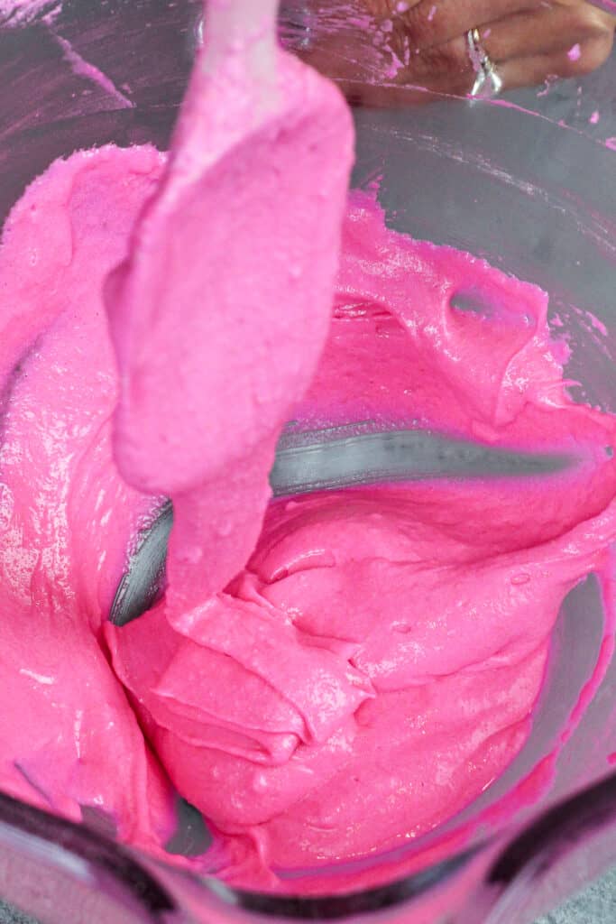 image of pink macaron batter that's been mixed perfectly and is ready to be piped
