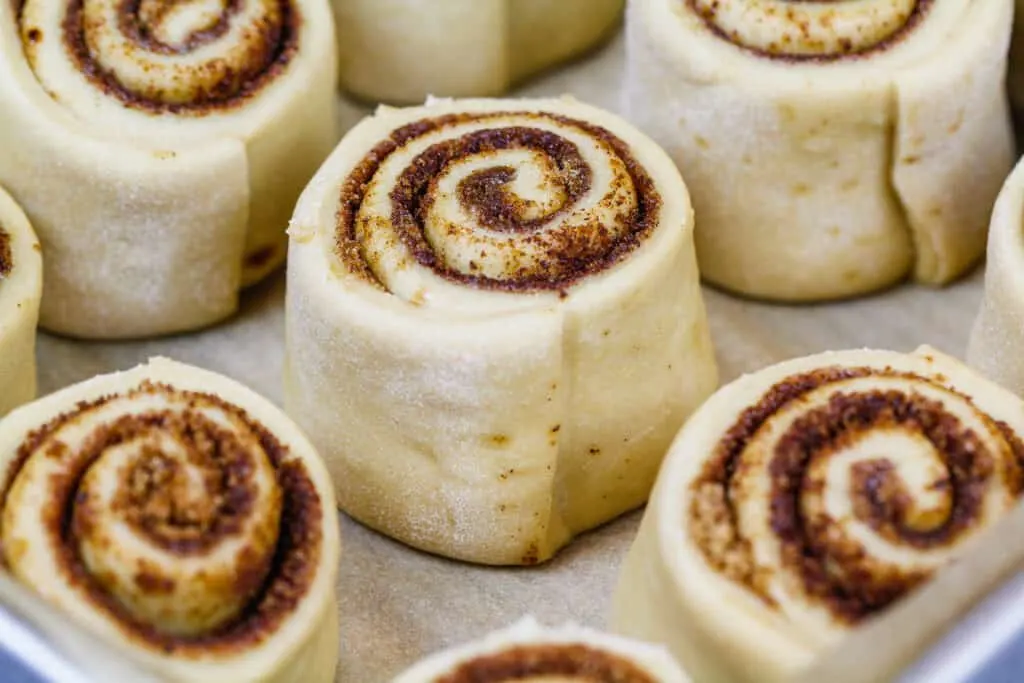 image of coffee cinnamon rolls in a pan ready to be proofed