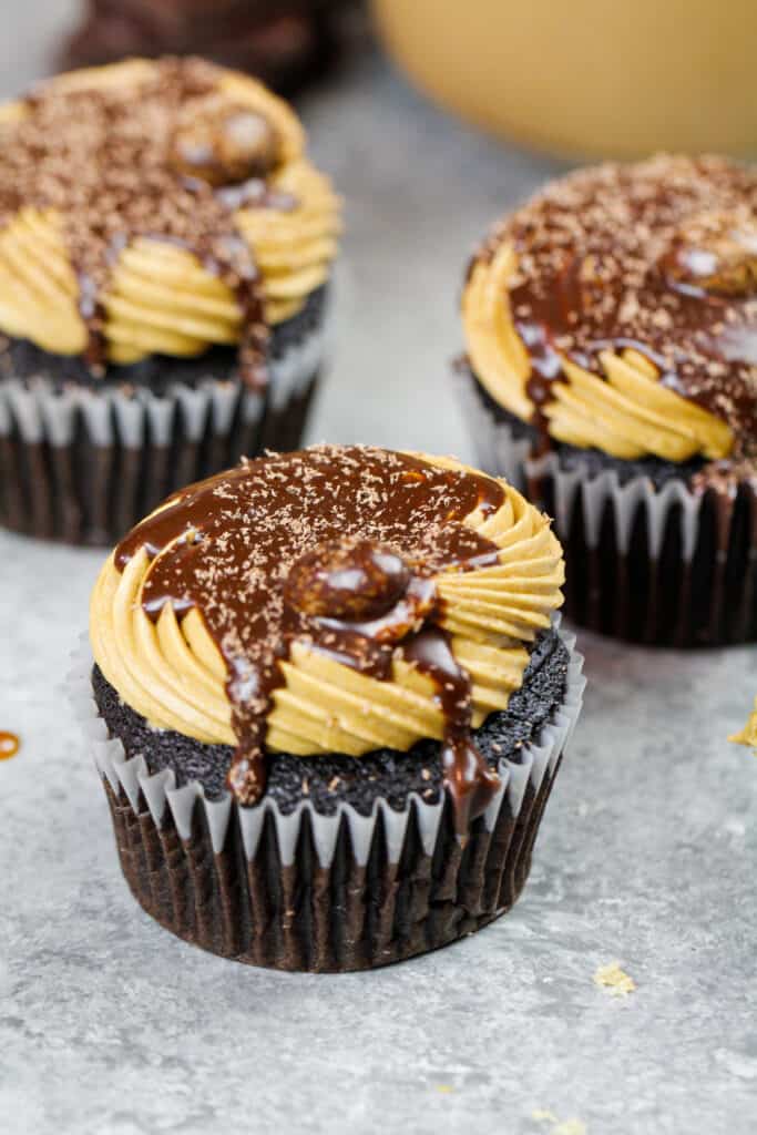 image of mocha cupcakes frosted with espresso buttercream frosting and drizzled with espresso ganache