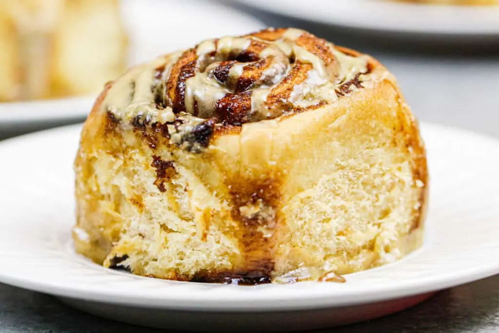 image of a coffee flavored cinnamon roll on a plate