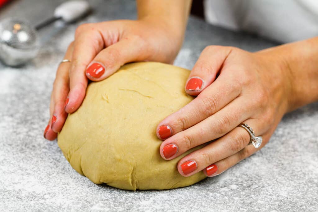 image of cinnamon roll dough that's been resting to relax the gluten before being rolled out