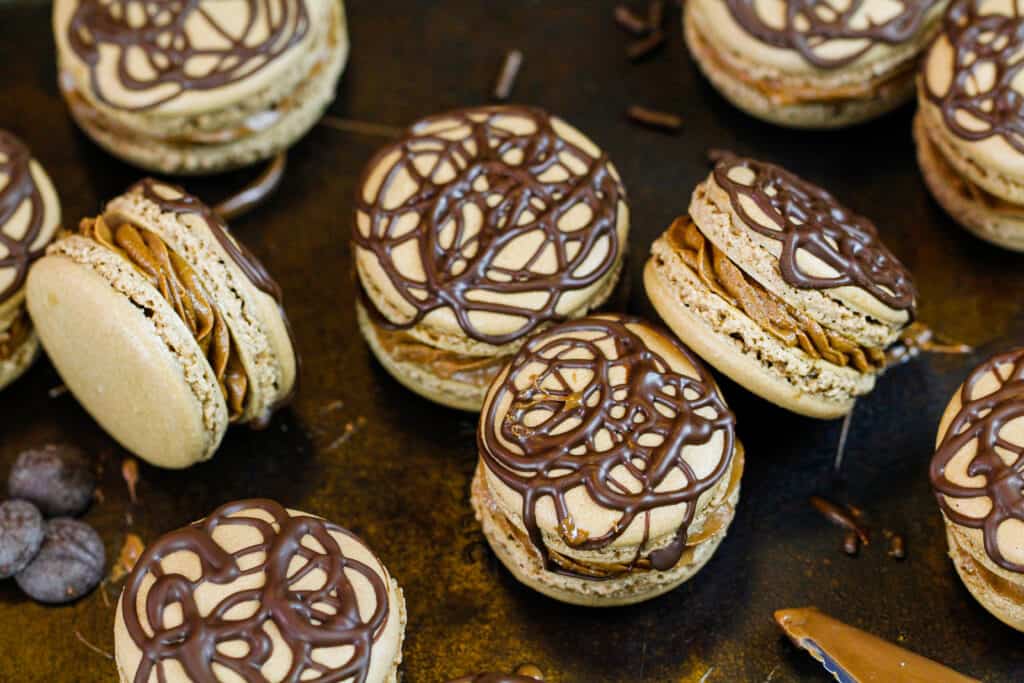 image of chocolate nutella macarons decorated with drizzled chocolate