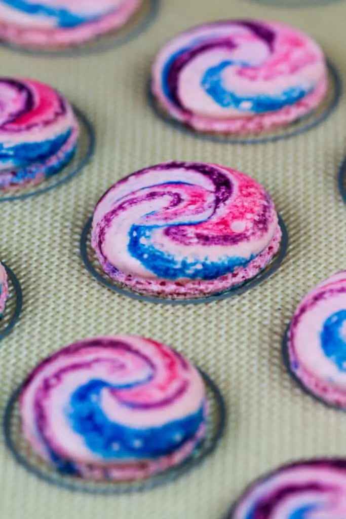 image of baked cotton candy colored macaron shells