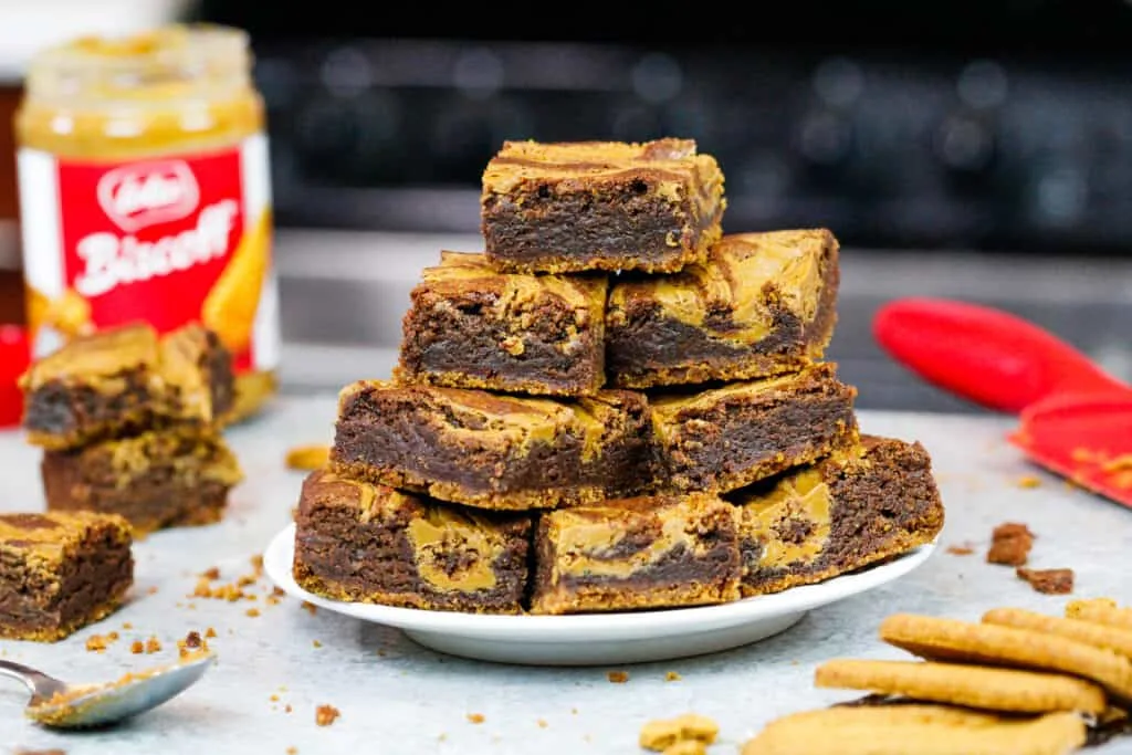 image of biscoff brownies baked and stacked on a plate
