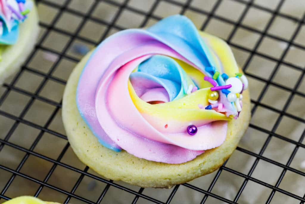 image of a buttercream cookie decorated with pretty pastel buttercream frosting
