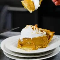 image of a mascarpone pumpkin pie slice that's been cut into to show how creamy it is