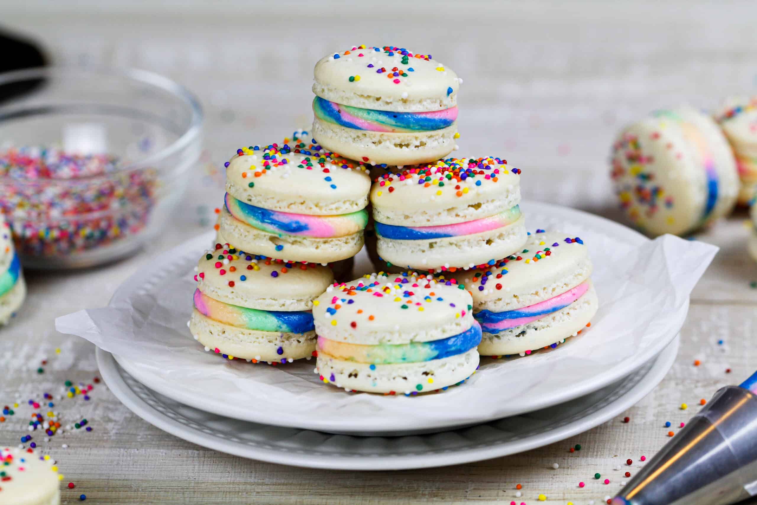 image of rainbow macarons stacked on a plate