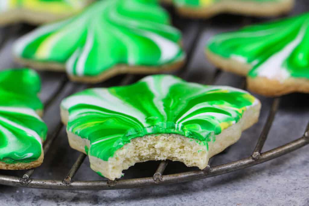 image of marbled sugar cookies made with soft and chewy cream cheese cookies topped with swirled royal icing