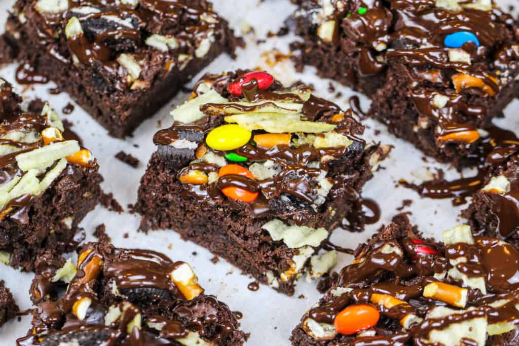 image of kitchen sink brownies topped with potato chips, pretzels, oreos and M&Ms