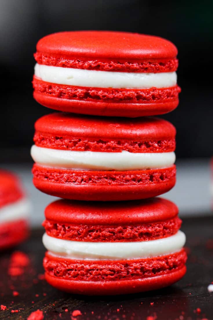 image of red velvet macarons filled with cream cheese frosting