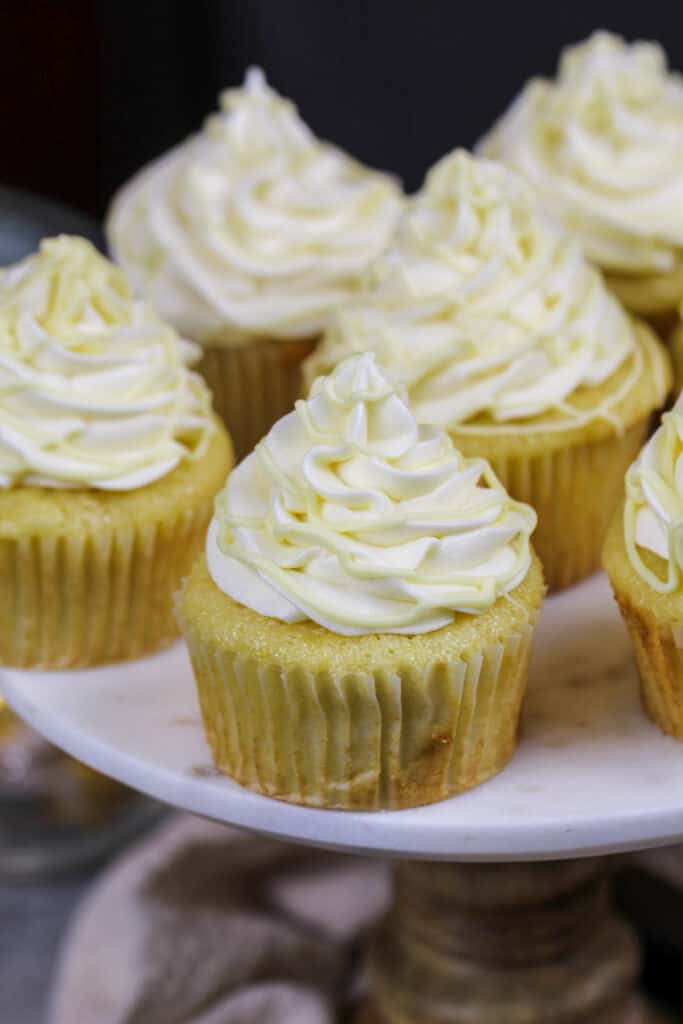 image of white chocolate cupcakes filled with white chocolate ganache and frosted with white chocolate buttercream