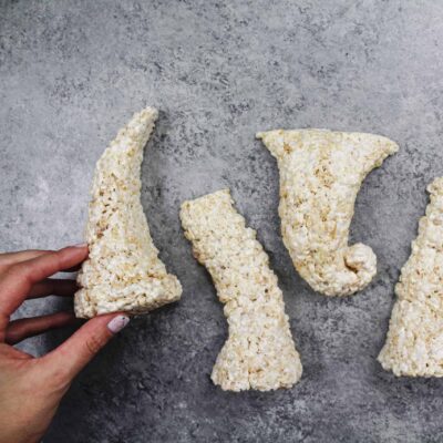 image of cake decorating friendly rice krispies shaped into legs and a trunk to make an elephant cake