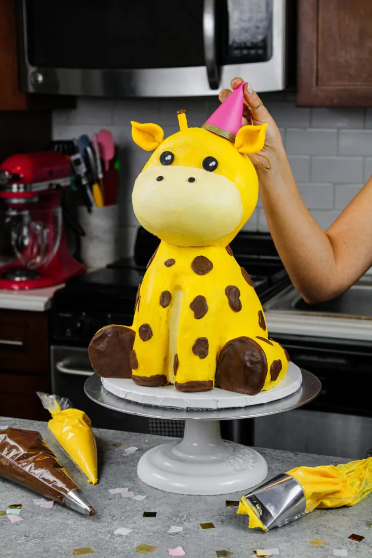 image of a giraffe cake made with buttercream and rice krispies