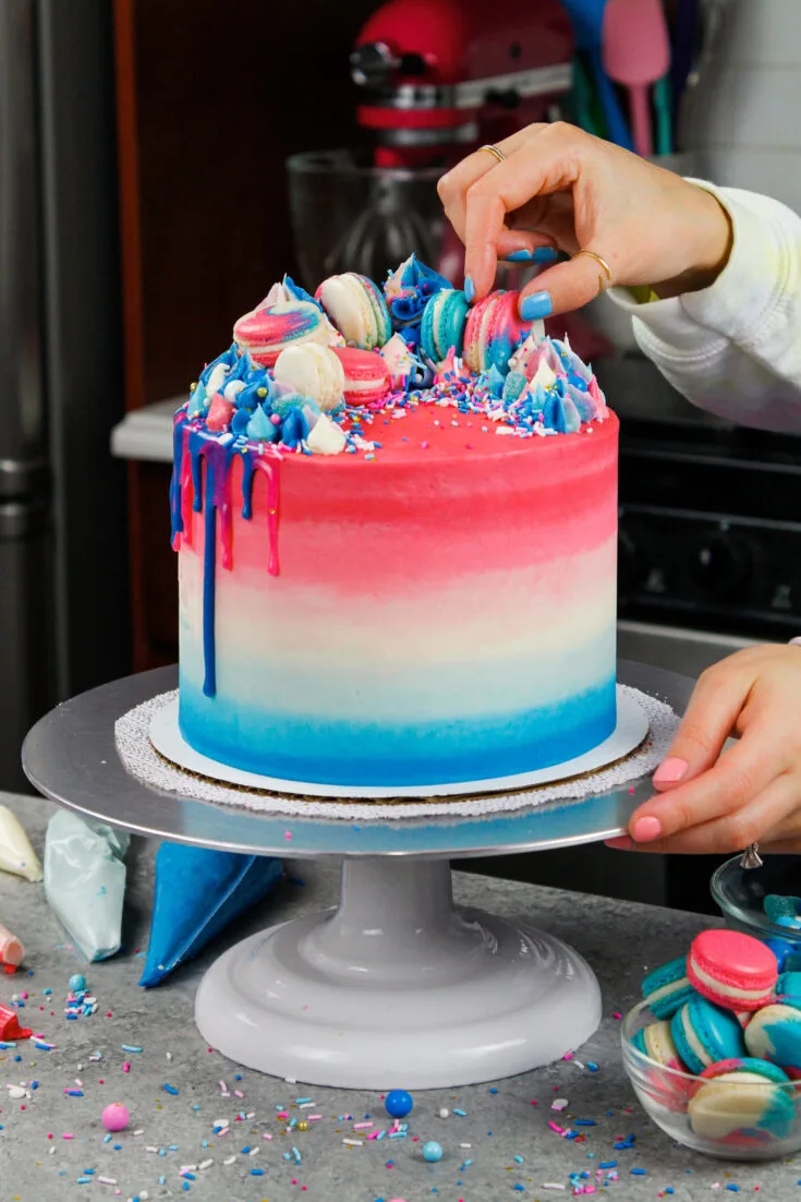 image of a pretty gender reveal cake decorate with blue and pink frosting and customized to celebrate either a boy or girl