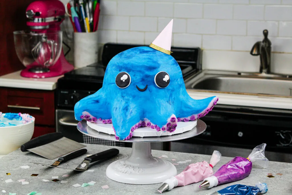 image of an octopus birthday \cake made with colorful cake layers, buttercream and cake decorating rice krispie