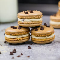 image of cookie dough macarons filled with cookie dough buttercream and mini chocolate chips