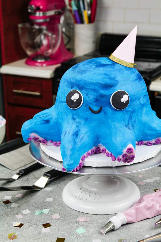 image of an octopus cake made with colorful cake layers, buttercream and cake decorating rice krispie