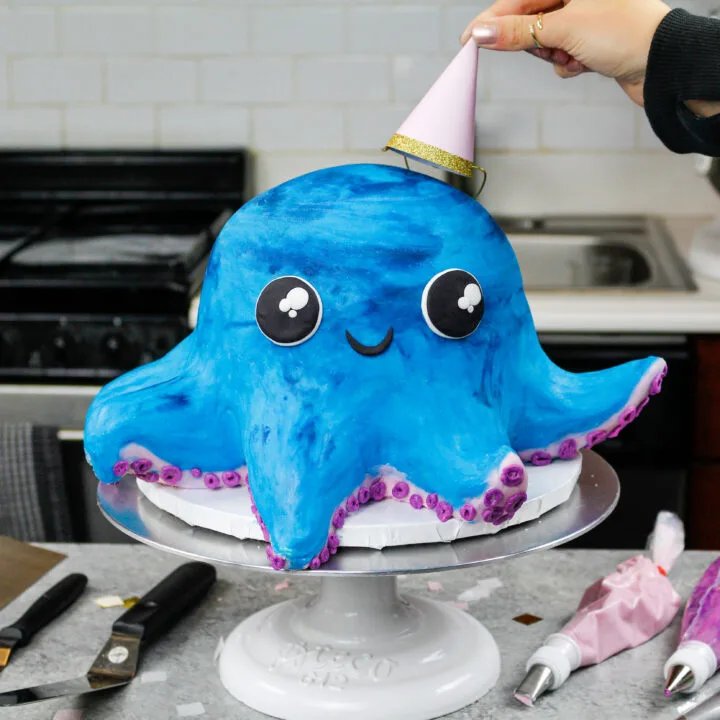 image of an octopus cake made with colorful cake layers, buttercream and cake decorating rice krispie