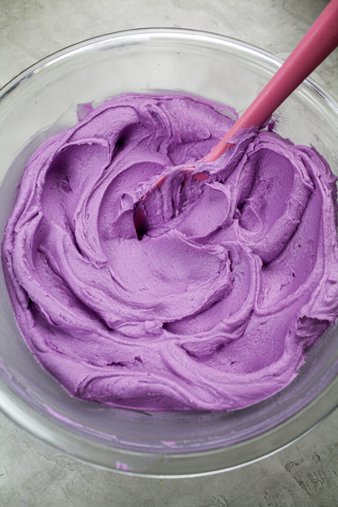 image of beautiful purple frosting colored with americolor gel food coloring to make a buttercream rosette cake