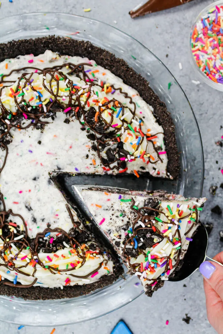 image of an oreo cream pie decorated with sprinkles and buttercream