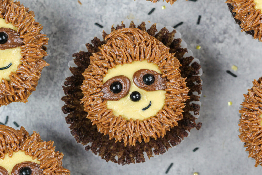 image of a sloth cupcake that's been unwrapped and is ready to be eaten