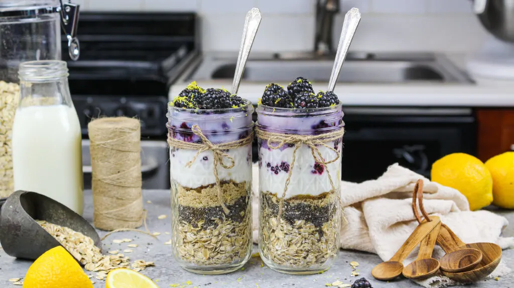 image of blackberry overnight oats made in advance in cute mason jars