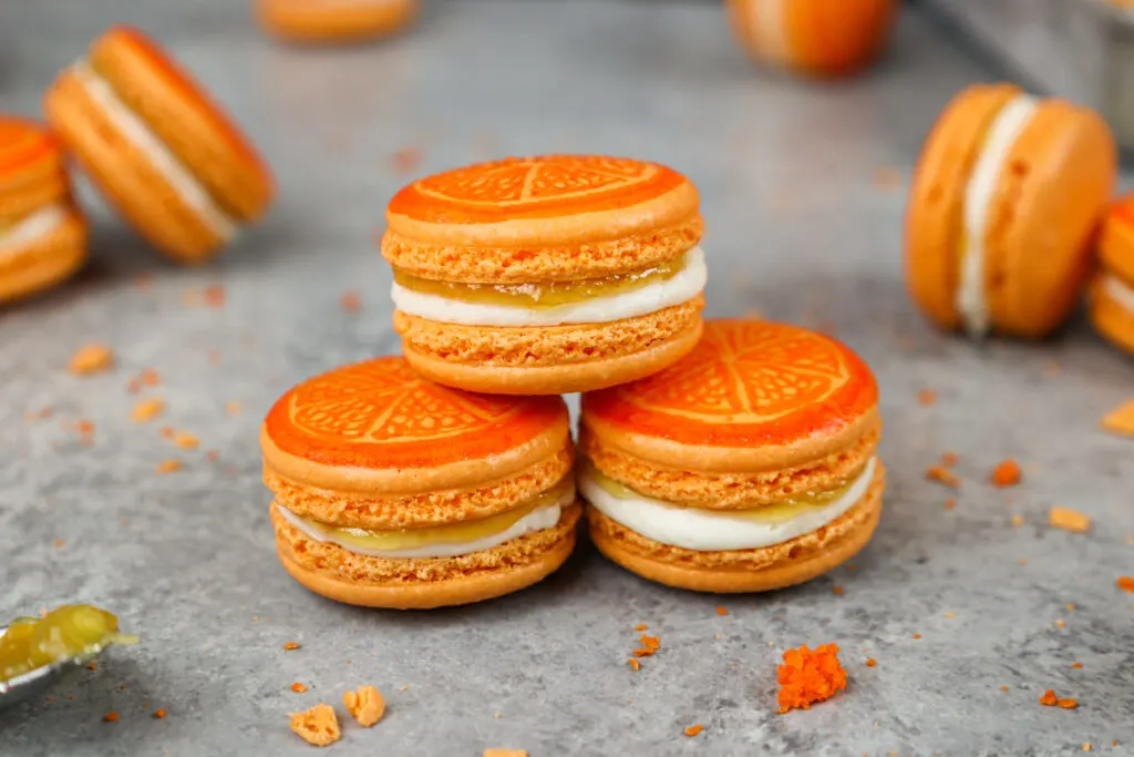 image of adorable orange macarons filled with orange marmalade and buttercream