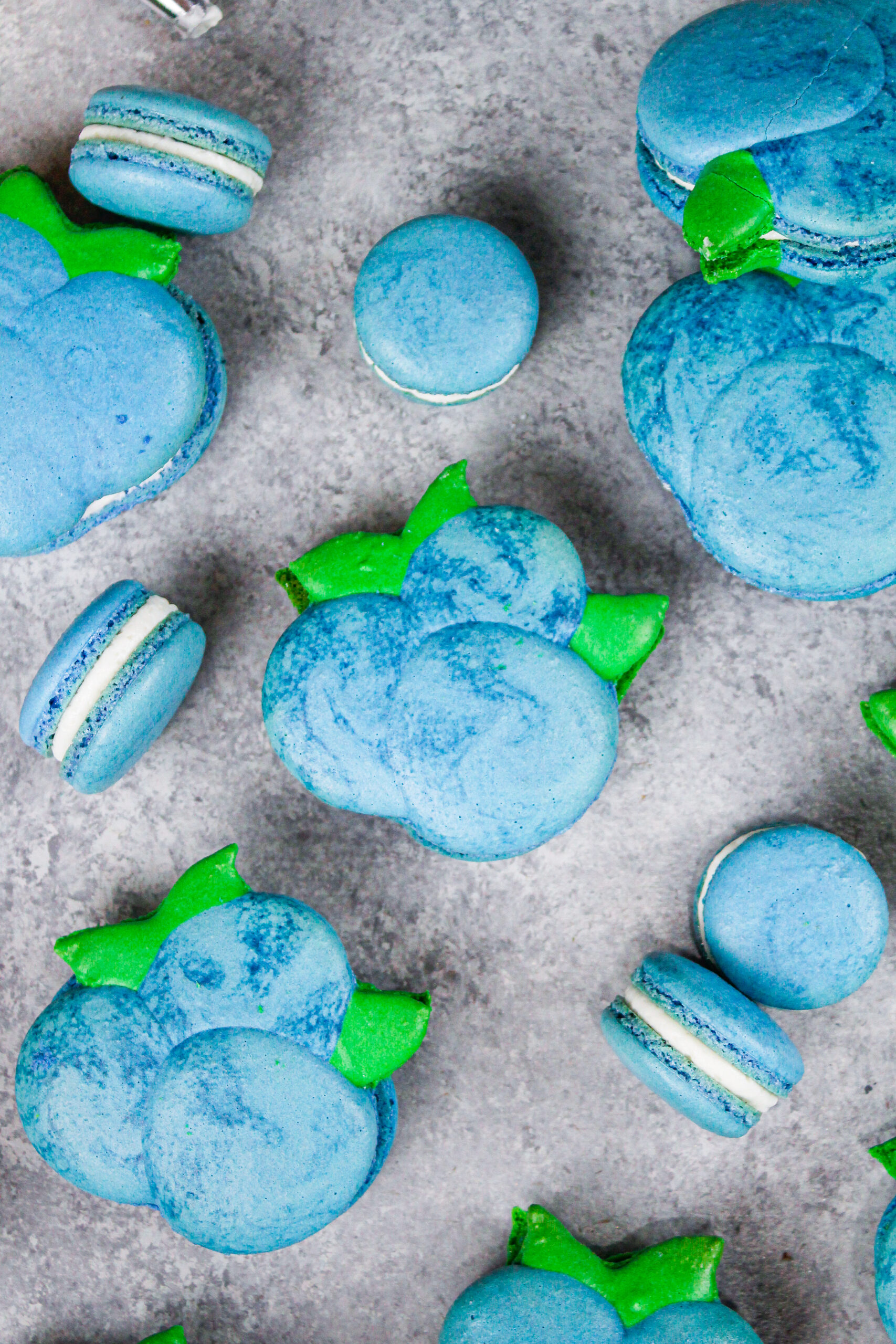 image of blueberry shaped macarons baked and filled with buttercream and blueberry jam