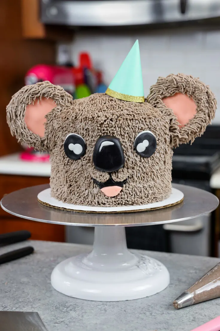 image of an adorable buttercream koala cake made with chocolate cake layers