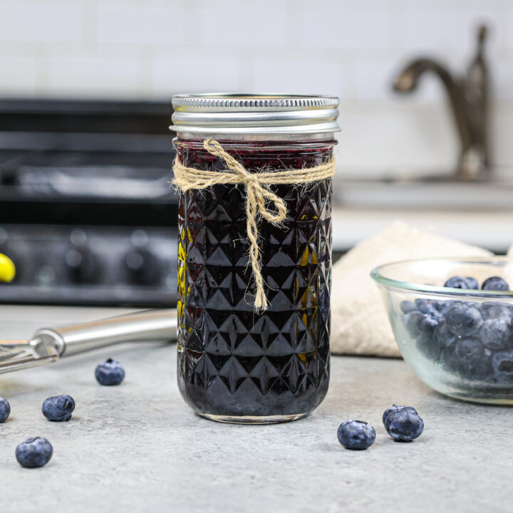 image of blueberry simply syrup poured into a mason jar for storage