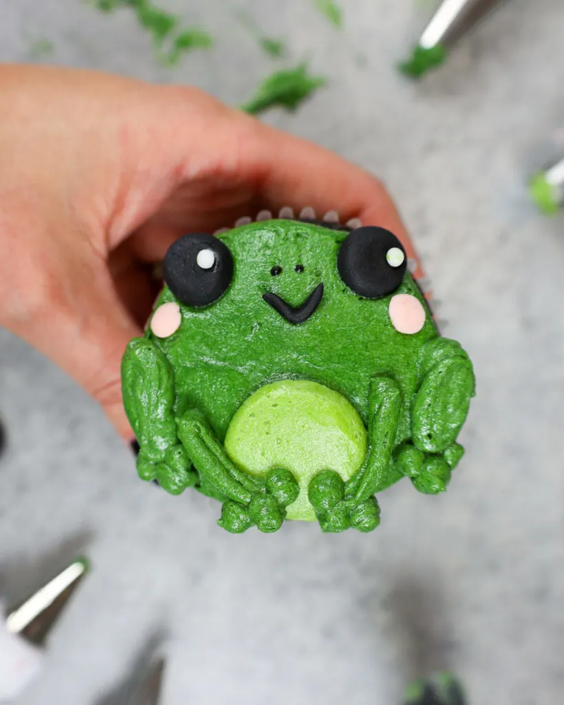 image of an adorable buttercream frog cupcake