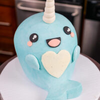 image of a cute narwhal cake made with buttercream