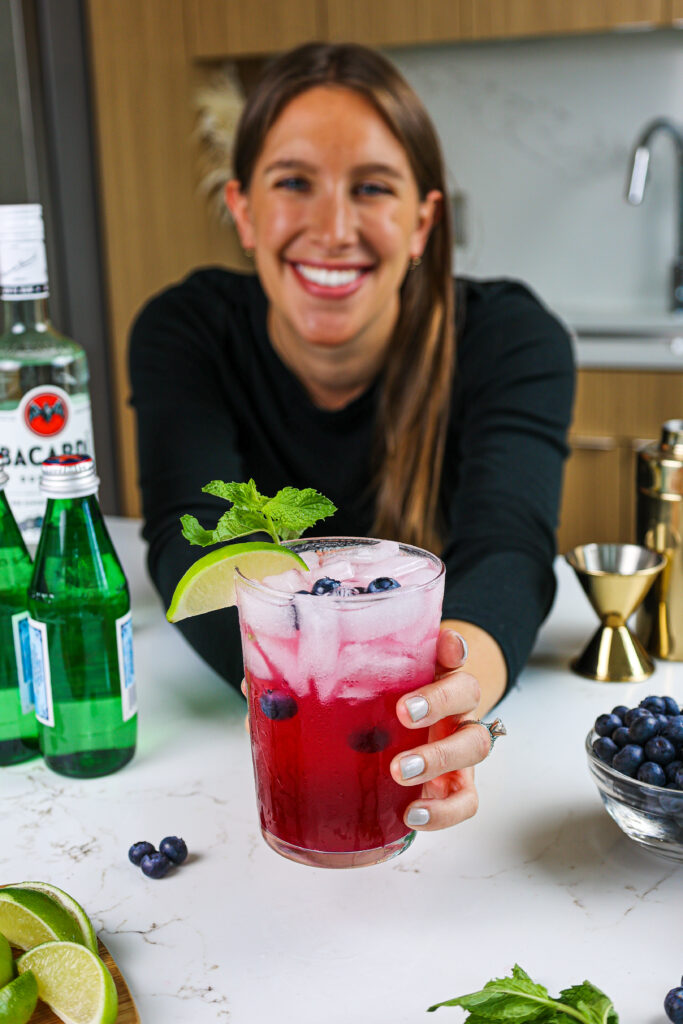 image of chelsey white serving a blueberry mojito
