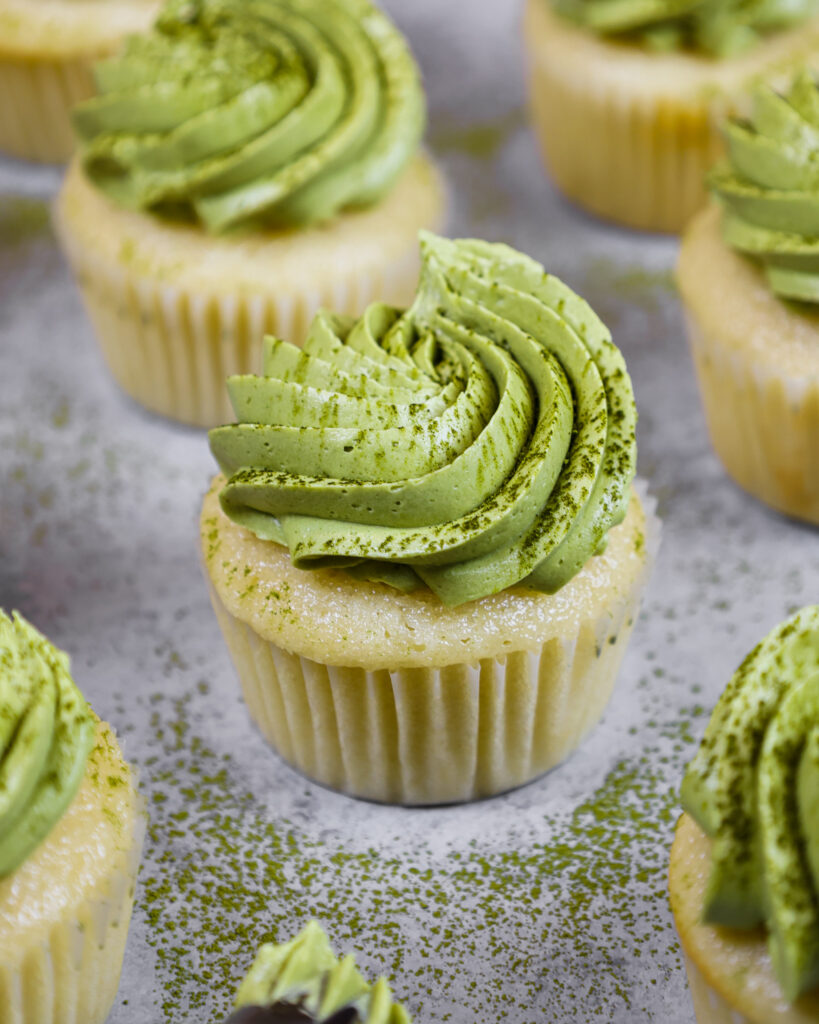 image of matcha cupcakes topped with a not too sweet matcha buttercream