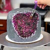 image of a geode cake made with rock candy and edible gel food coloring paint