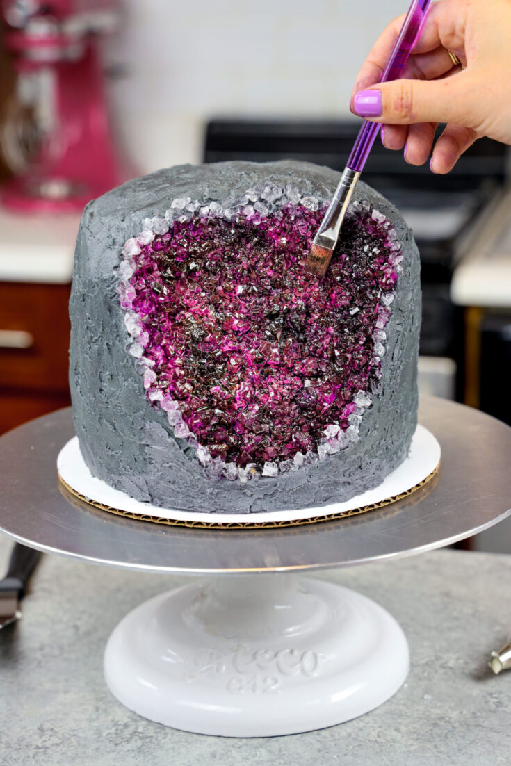 image of a geode cake made with rock candy and edible gel food coloring paint