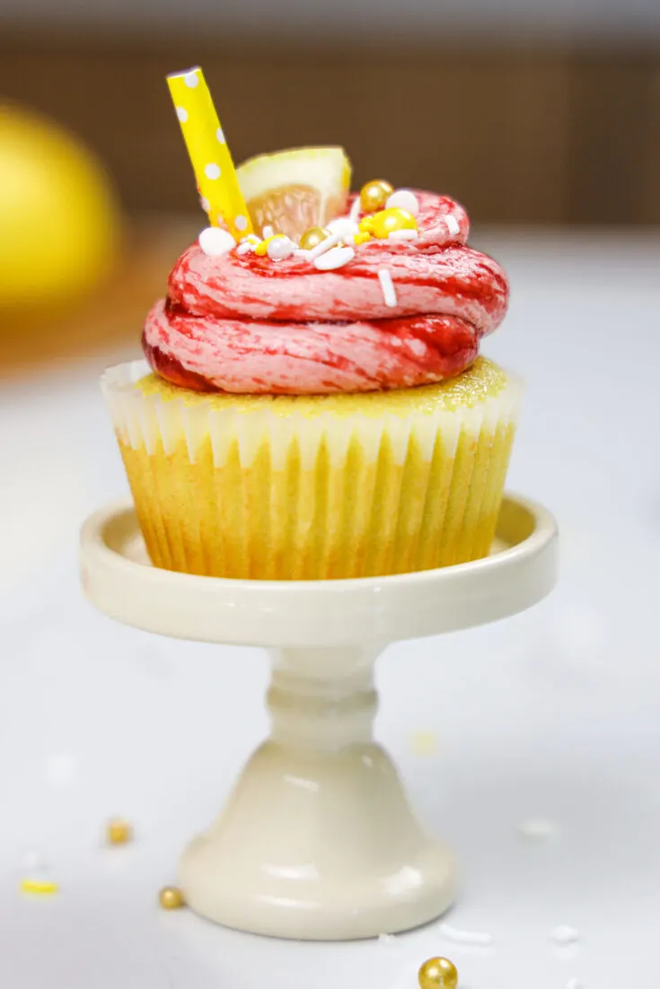 image of raspberry lemonade cupcakes decorated with a little lemon slice and cute matching straw